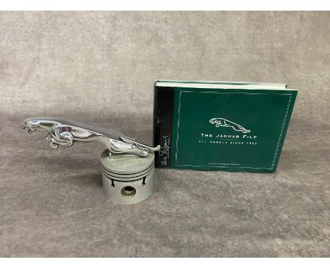 A vintage Jaguar mascot mounted on a pistol head