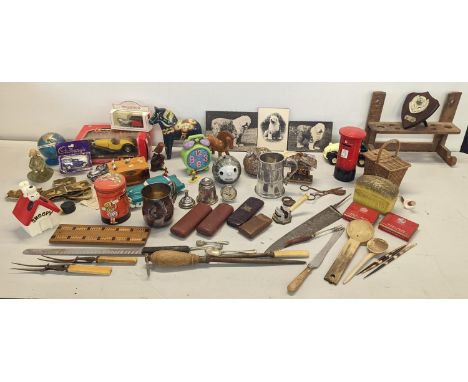 A mixed lot to include house hold ornaments, money boxes, model cars, spice rack and other items, Location: 