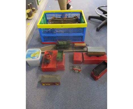 Hornby 0 gauge clockwork train set with an engine type 501, tender coach, wagon building, platform and track 