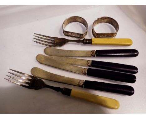 Two hallmarked silver napkin rings and a small quantity of cutlery. UK P&amp;P Group 1 (£16+VAT for the first lot and £2+VAT 