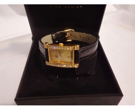 Time design ladies wristwatch with stone set gold plated bezel and black leather strap. UK P&amp;P Group 1 (£16+VAT for the f