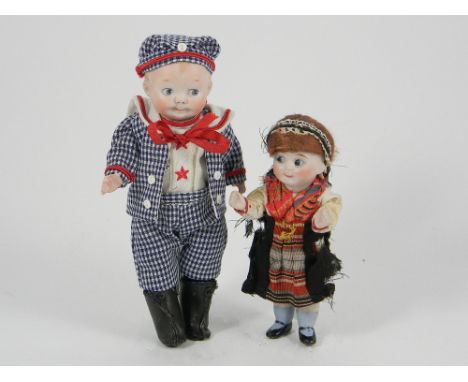 Rare A.M 320 miniature all-bisque character doll, German circa 1910, with side glancing blue intaglio eyes, smiling closed mo