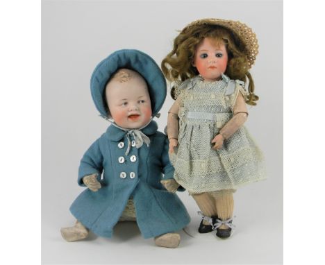 Gebruder Heubach bisque head character doll, with weighted blue glass eyes, closed mouth and brown wig, on a fully jointed wo