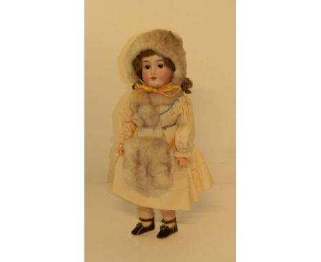 A Max Handwerck bisque head girl doll in original clothes, German circa 1910, with weighted brown glass eyes, open mouth with