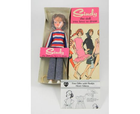 A Pedigree Sindy in Weekenders in original box, 1960s, Ref. 12GSS Auburn, wearing blue jeans, red, white and blue top and whi