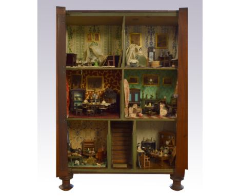 Fine and rare early English mahogany dolls cabinet and contents, circa 1820, the exterior with inlaid strips and three glazed