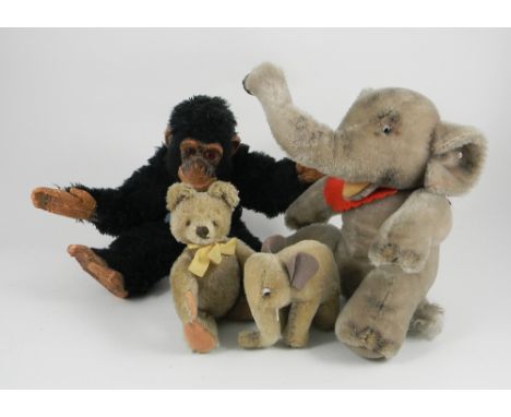 Steiff Elephants, original Teddy and Deans Chimpanzee, 1950s, larger seated Elephant with swivel neck, open felt lined mouth 