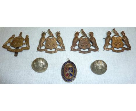 4 Leeds Regiment cap badges and 2 associated white metal buttons and an enamel Bradford Battalion P.D.O (West Yorks Regt) pen