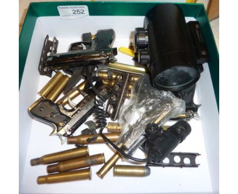 Box containing various items inc lighters, inert ammunition shell cases, clips, laser sight etc