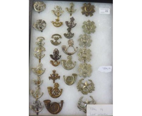 Collection of 29 light infantry cap badges in glazed display case inc Cornwall, 1st Volunteer battalion, Royal Guernsey 1RDM,