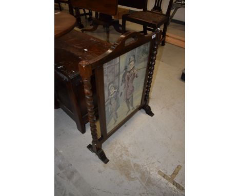 An Edwardian fire screen having barley twist supports