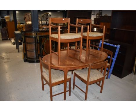 A vintage teak table and six chairs (four plus two), by McIntosh (chairs numbered 4003)