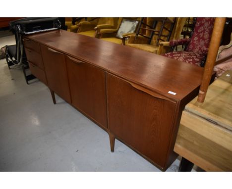 A vintage teak sideboard, McIntosh Dunvegan, having triple cupboard and three drawer section, width approx. 202cm, a lovely e