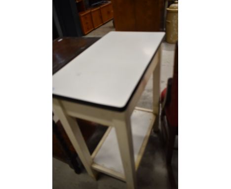 A vintage kitchen work station or prep table