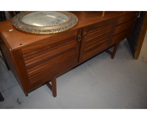 A vintage McIntosh sideboard having louvre doors and three drawers