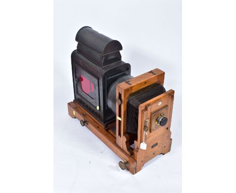 A 'KING ENLARGER' MAGIC LANTERN with an oak frame and tinplate body along with two covers