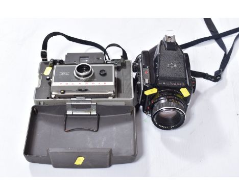 A MAMIYA M645 1000S MEDIUM FORMAT CAMERA fitted with a Sekor C 80mm f2.8 lens ( missing winding handle assemble but does wind