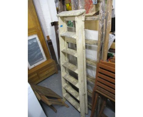 Two vintage pine step ladders, one painted white and a similar two section ladder 