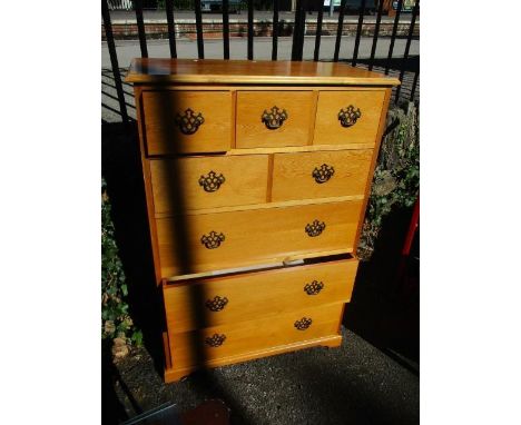 A modern pine chest of drawers standing on bracket feet, 45"h x 30 1/4" w 