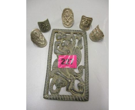 A bronze Islamic bell part, together with five white metal oriental rings 