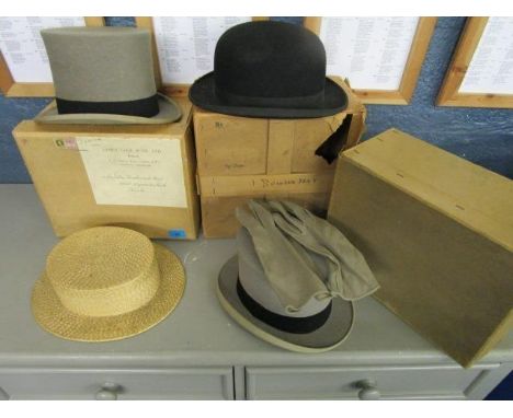 A selection of vintage gentleman's hats to include a bowler hat and a top hat, formally the property of Lord Dashwood of West