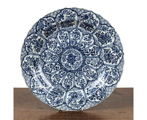 Large blue and white chargerChinese, 19th Centurypainted in panels with foliate and leaf designs, Kangxi Artemisia mark, 38cm