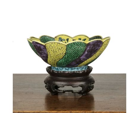 Ao-Kutani Kikugata bowlJapanese, 19th Centurydecorated in green, aubergine, yellow, blue, and black enamels with a central fa