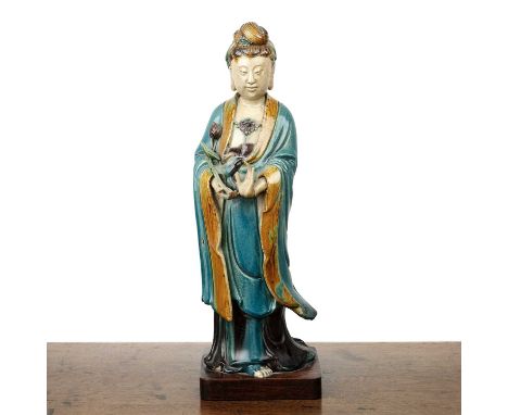 Large Shiwan pottery model of GuanyinChinese, 19th Centurywith turquoise and robe with honey coloured sleeves and collar, the