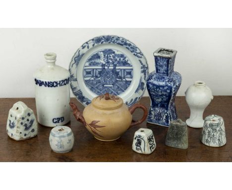Group of piecesChinese and Japaneseincluding various blue and white porcelain weights, a Yixing teapot, a Japanese sake bottl