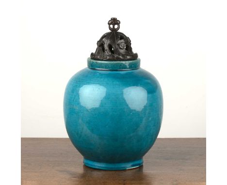 Monochrome pale blue ovoid jarChinese, 19th Centuryof plain form, with a carved hardwood associated lid, the vase 21cm highTh