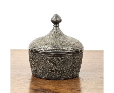 Engraved white metal small powder case and coverIndianwith paisley designs, and knopped finial to the lid, 9cm diameter x 9.5