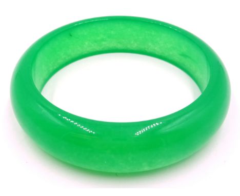 Green jade bangle  Condition Report Click here for further images, condition, auction times & delivery costs