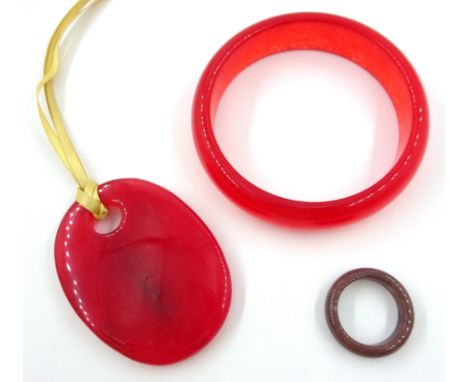 Red jade pendant, jade ring and red jade bangle Condition Report Click here for further images, condition, auction times & de