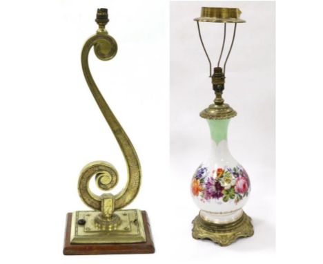 A Brass Lamp Base in the Form of a Treble Clef, early 20th century, on a rectangular base and wooden plinth, 56cm high; and A