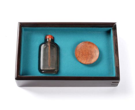 A Chinese Smoky Quartz Snuff Bottle, Qing Dynasty, of shouldered rectangular form, with red agate stopper and bone spoon, 6cm