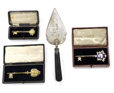 Three Silver-Gilt Presentation Keys and A Silver Trowel, various makers, 1908-1923, three with presentation inscription to ei