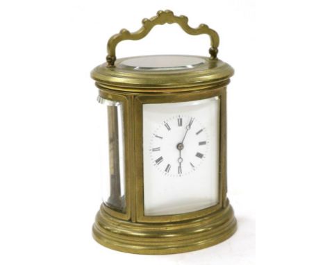 A Brass Oval Striking Carriage Clock, circa 1890, carrying handle, enamel dial with Roman numerals, twin barrel movement with