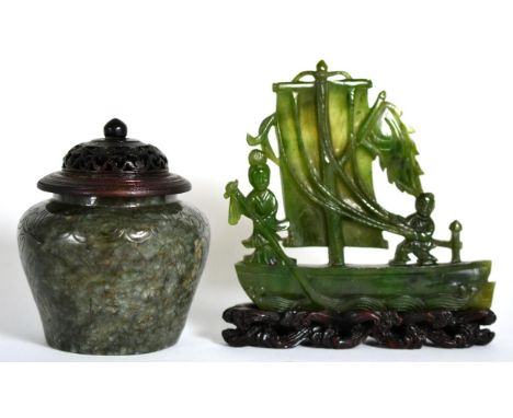 A Chinese Jade Model of a Sailing Boat, with two figures on deck, 11.5cm long, on a wooden stand; and A Jade Type Jar, with i