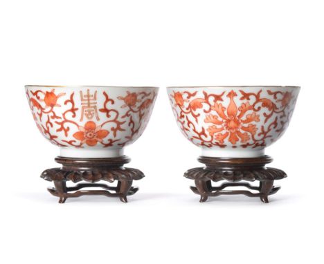 A Pair of Chinese Porcelain Tea Bowls, Tongxi reign mark, painted in orange with lotus, seal mark in red, 9cm diameter