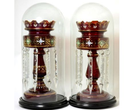 A Pair of Ruby Glass Lustres, circa 1900, painted and gilt with foliage and strap work and hung with prismatic drops, 37cm hi