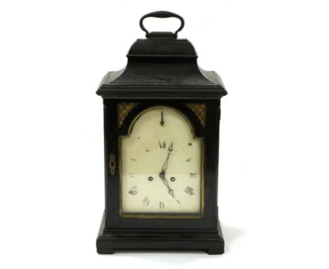 An Ebonised Striking Table Clock, early 19th century, inverted bell top with carrying handle, side viewing windows, painted a