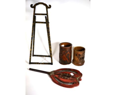 A Chinese Lacquer Table Easel, 19th century, with arched cresting and gilt leaf scroll decoration; Two Chinese Bamboo Brush P