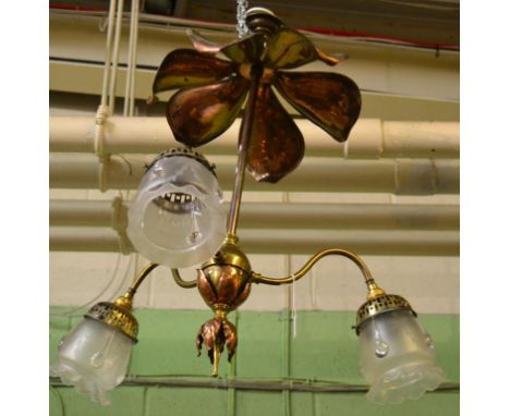An Art Nouveau Copper and Brass Light Fitting, circa 1900, with foliate mantel and terminal, the three scroll branches with e