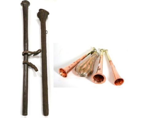 A Copper and Brass Coaching Horn, 88cm, in a leather case; A Similar Coaching Horn, 92cm, cased; Three Copper Hunting Horns, 