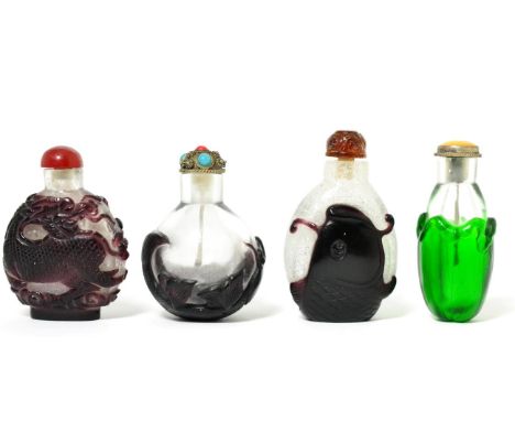 A Chinese Ruby Overlay Glass Snuff Bottle, carved with a carp, the inlaid metal stopper with metal spoon, 6.5cm high; A Simil
