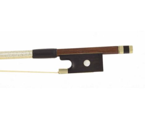 Nickel mounted violin bow stamped P.C., the stick round, the ebony frog inlaid with pearl eyes and the ebony adjuster with tw