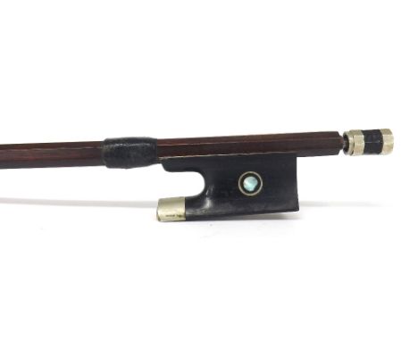 French nickel mounted violin bow, unstamped, the stick round, the ebony frog inlaid with nickel rings enclosing pearl eyes an