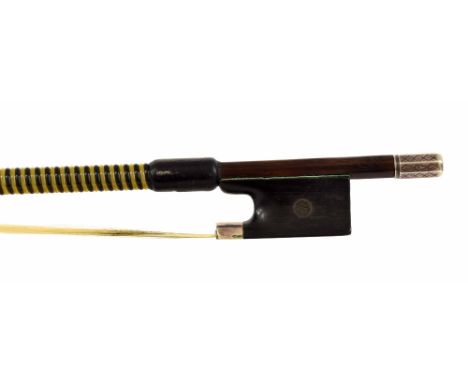 German silver mounted violin bow, unstamped, the stick round, the ebony frog with engraved eyes and with a silver overlaid eb