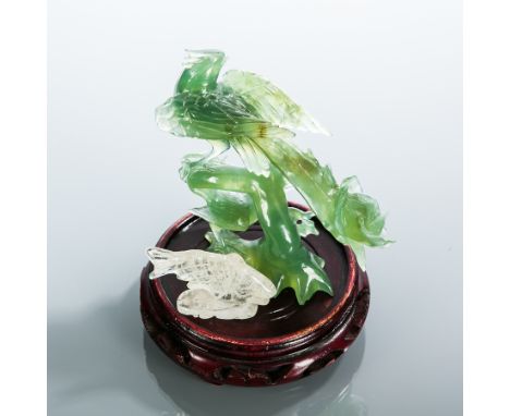 CHINESE GREEN GLASS STATUE OF A BIRD
and a rock crystal model of a fish, with a stand, the bird 13cm high, the fish 4cm high 