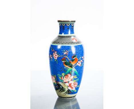 CHINESE CERAMIC VASE
of abluster form, with exotic bird decoration, mark to base, 19cm high 